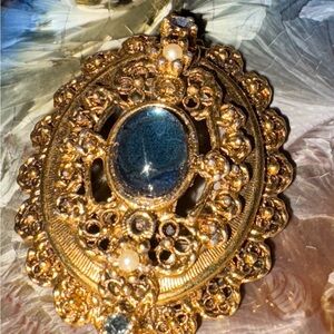 Elegant Gold and Blue Brooch